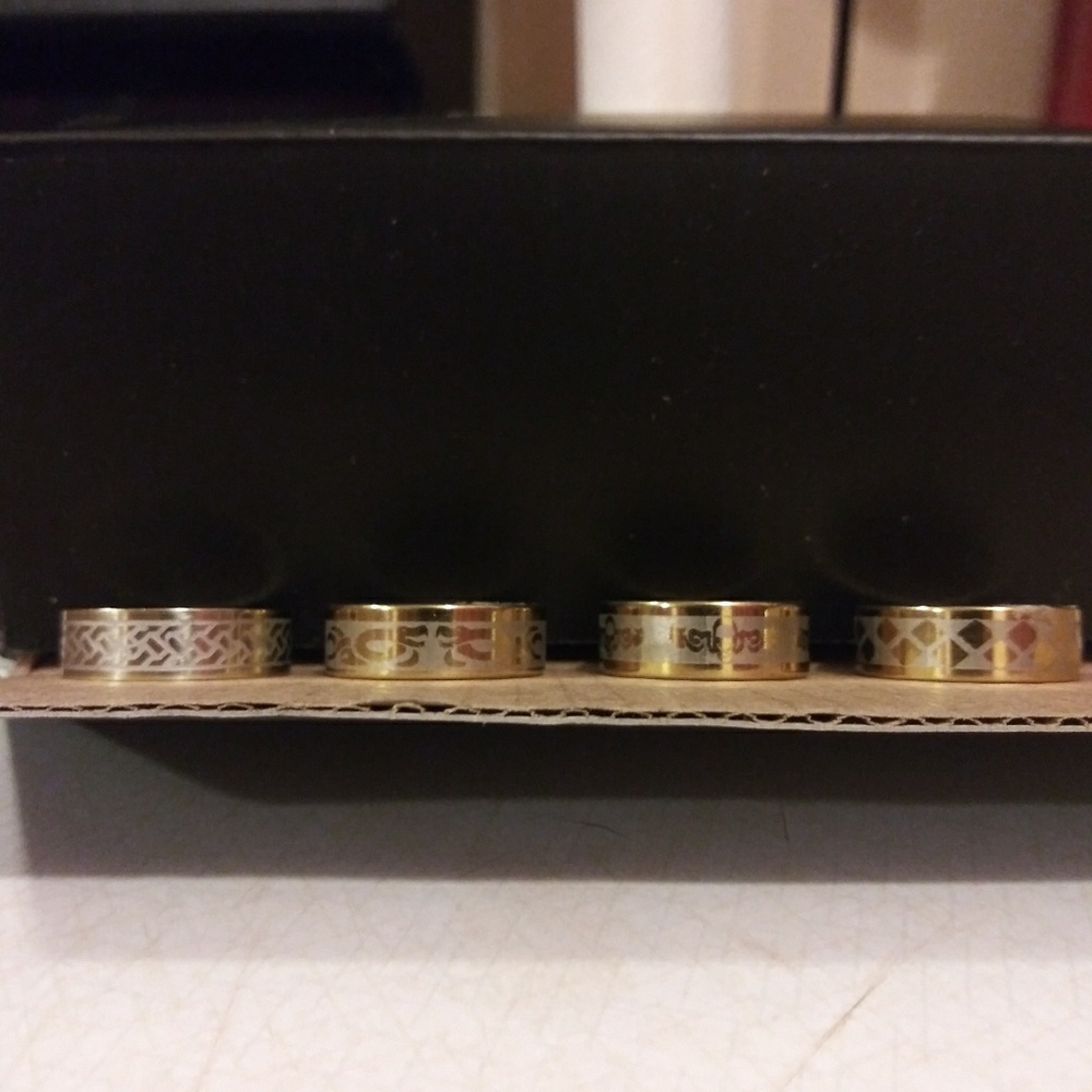 Lot of mens goldtone stainless steel rings